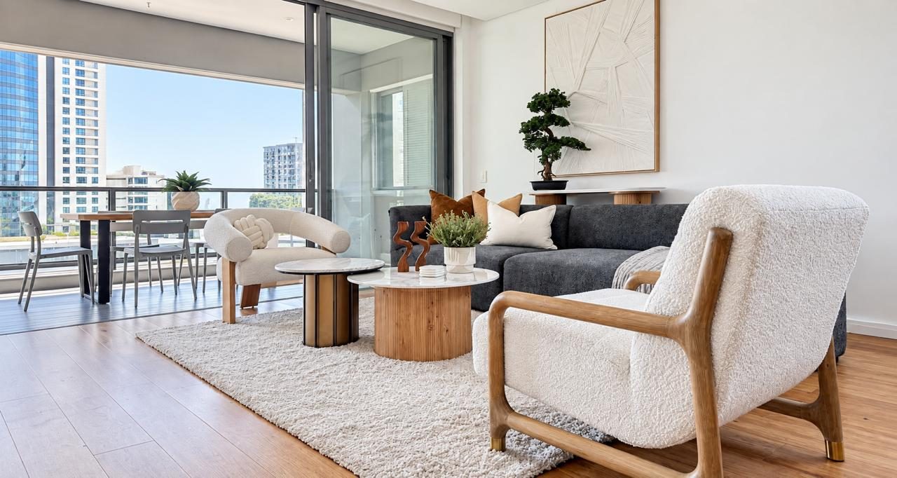 Styled Airhost apartment lounge opening onto a balcony